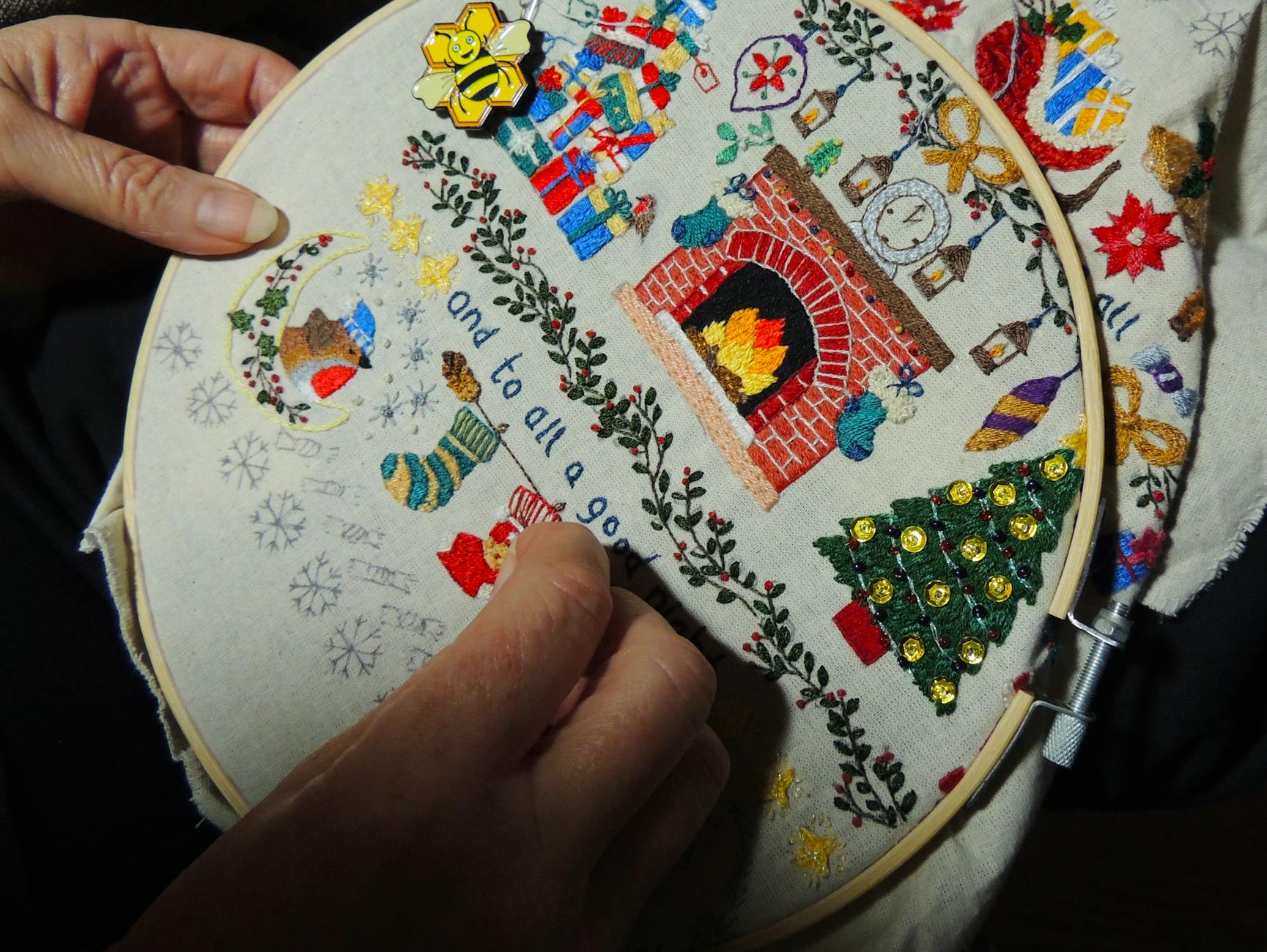 Embroidery machine stitching Christmas design on fabric