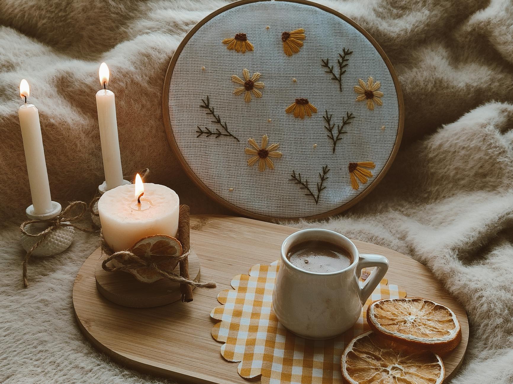 Machine embroidery hoop stitching mug rug design on fabric