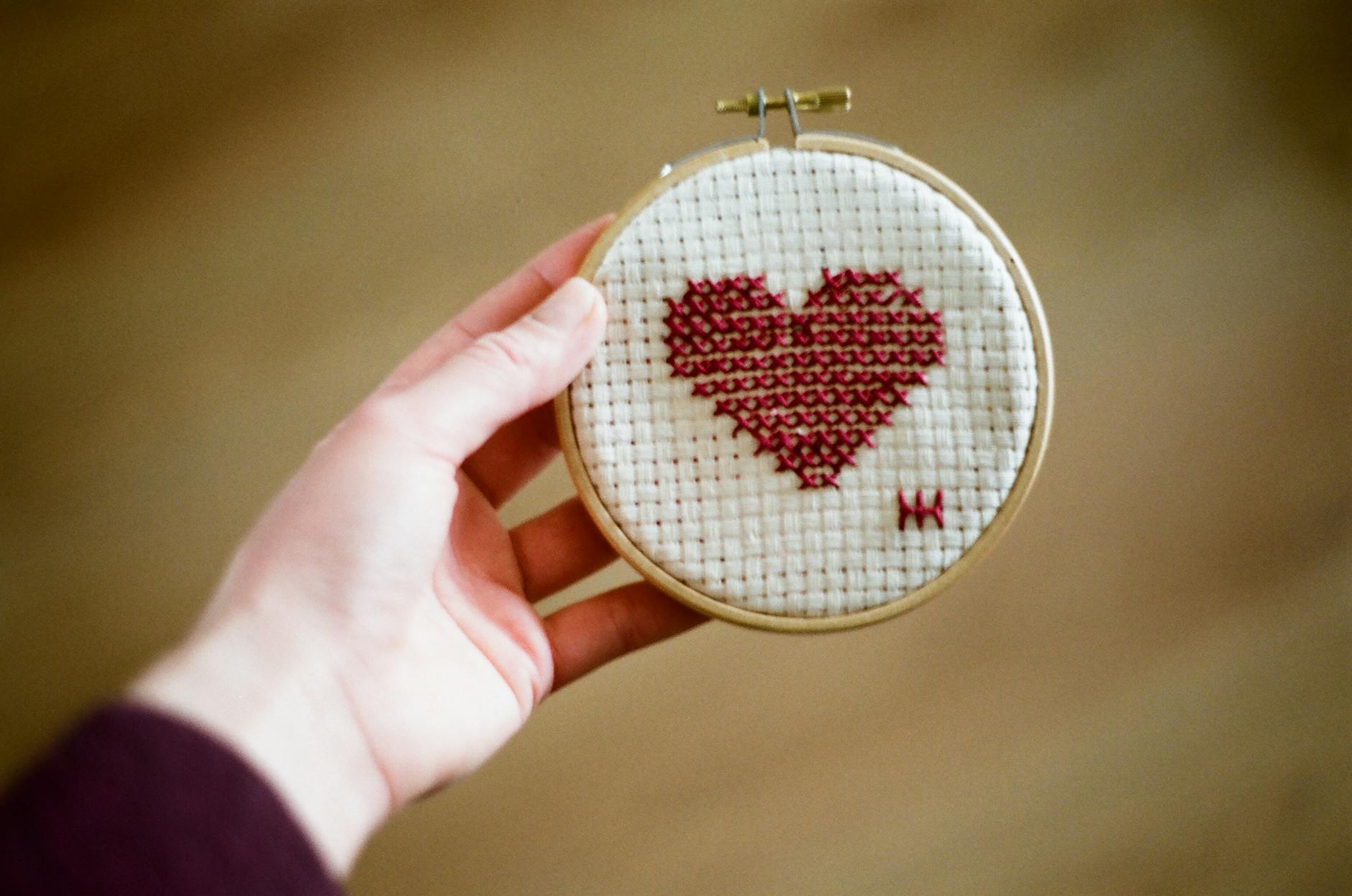 Embroidery machine stitching stick and sew design on fabric