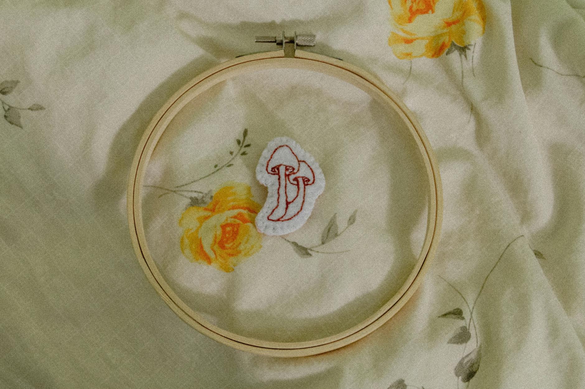 Embroidery machine stitching LEGO design on fabric