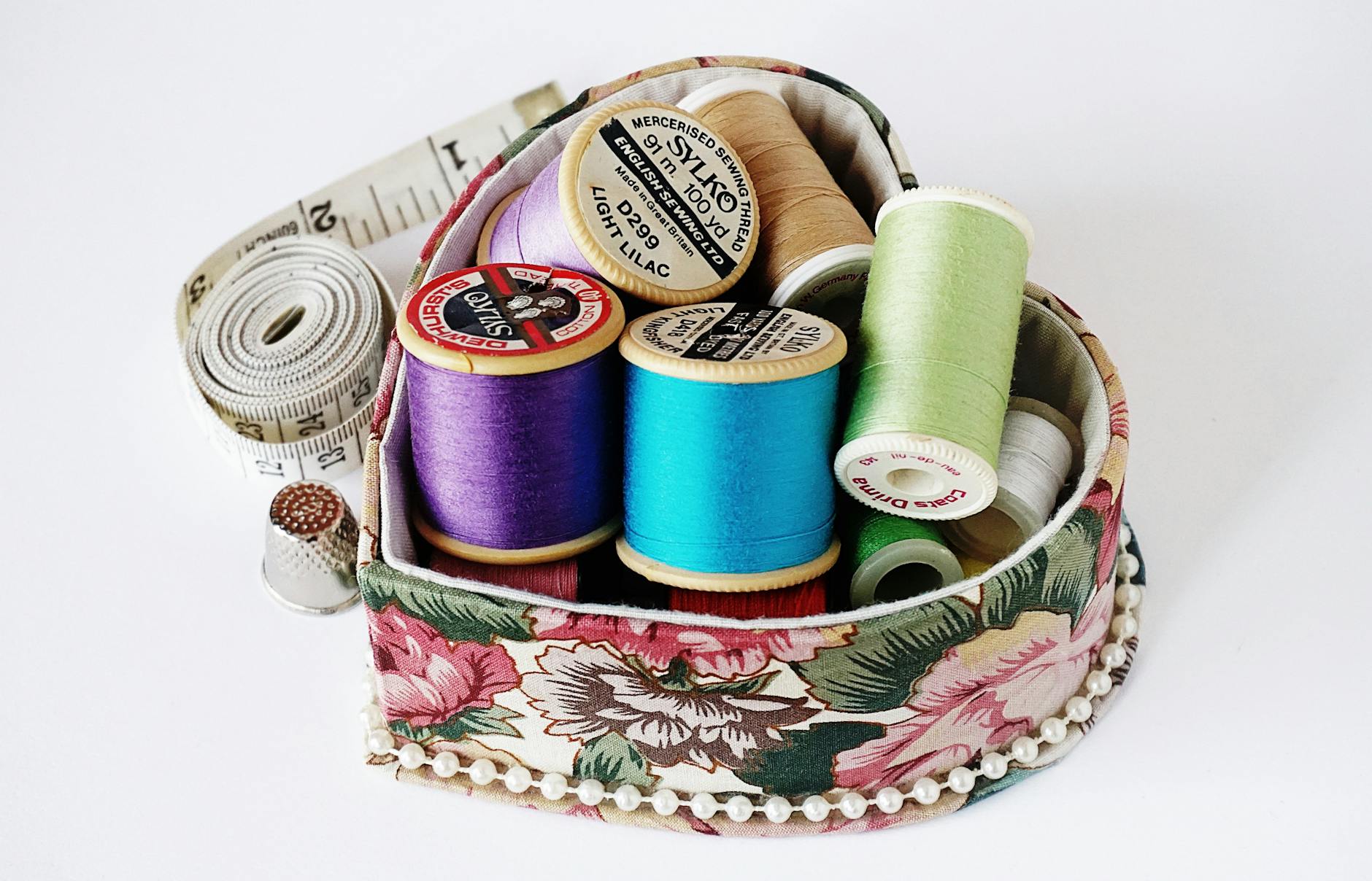 Embroidery machine stitching quilt fabric with detailed design