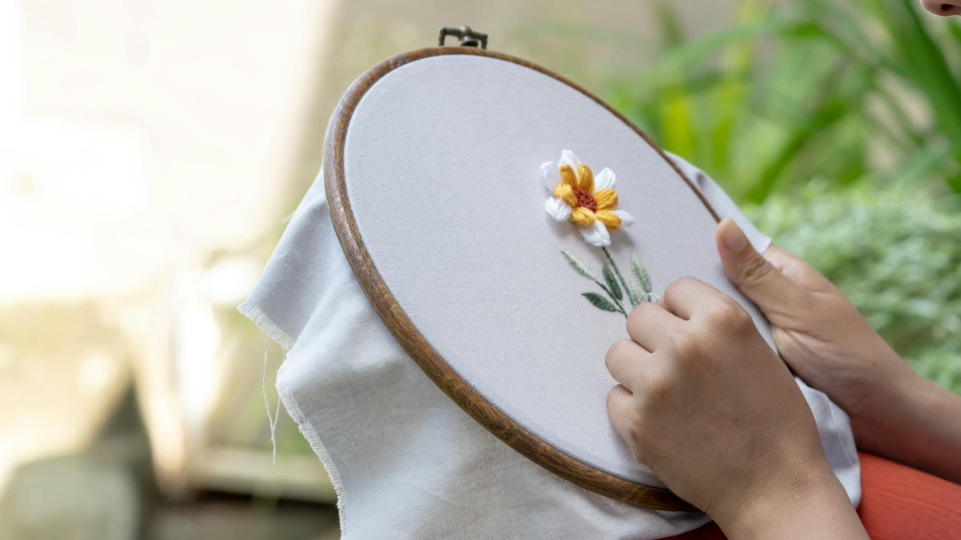 Fabric with piglet embroidery design in hoop on machine