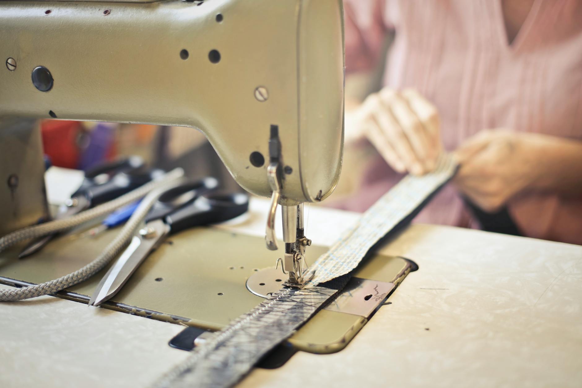 Embroidery machine stitching train design on fabric