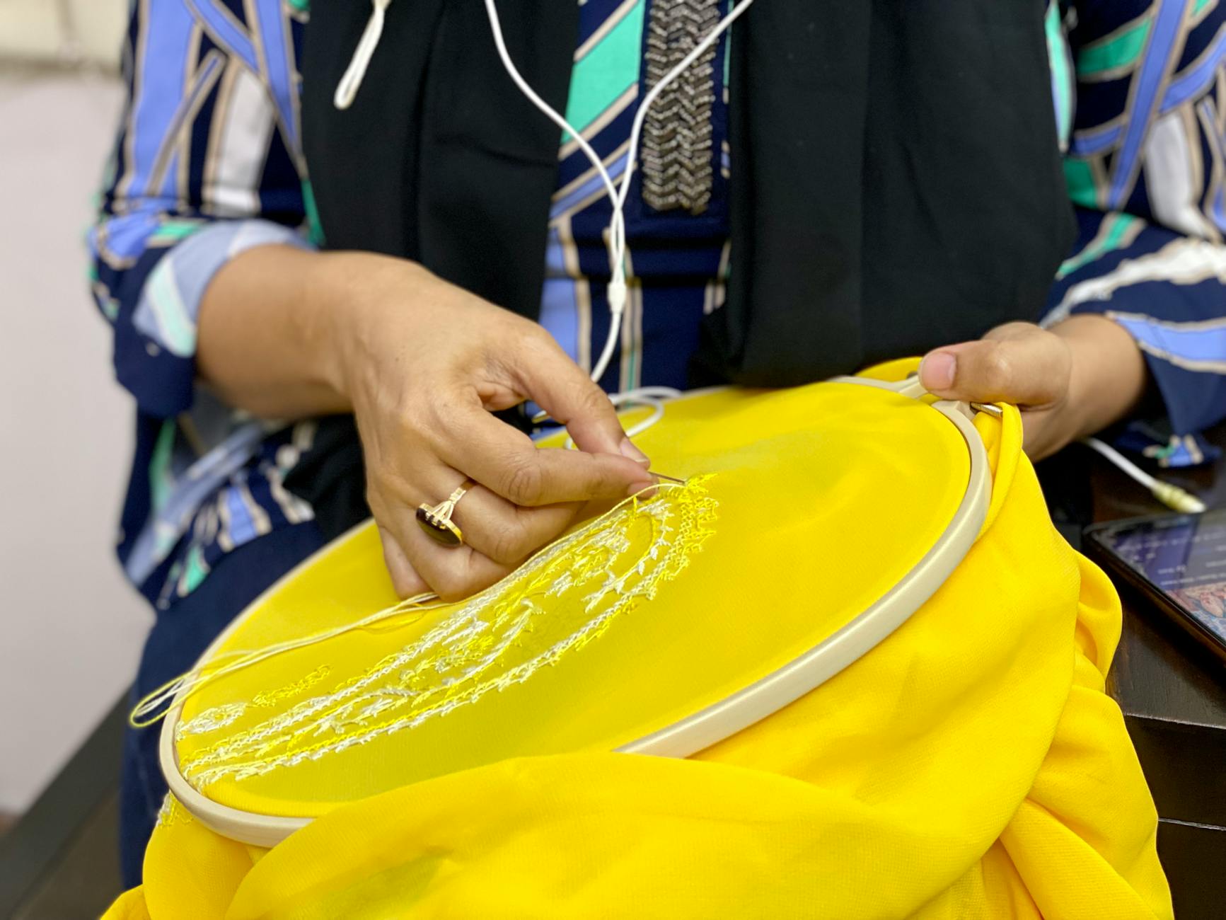 Machine embroidery of Native American tribal designs on fabric